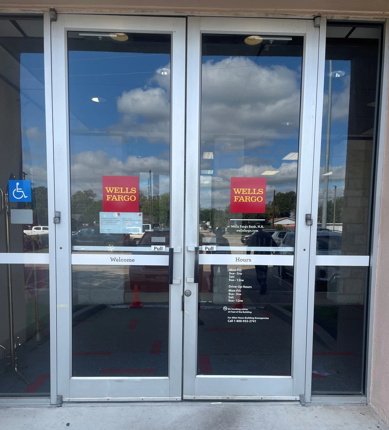 Door graphics and accessibility signage for a business entrance